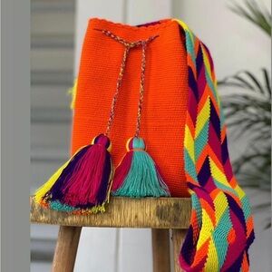 Orange bag with nice multicolour to use on any occasion.✨